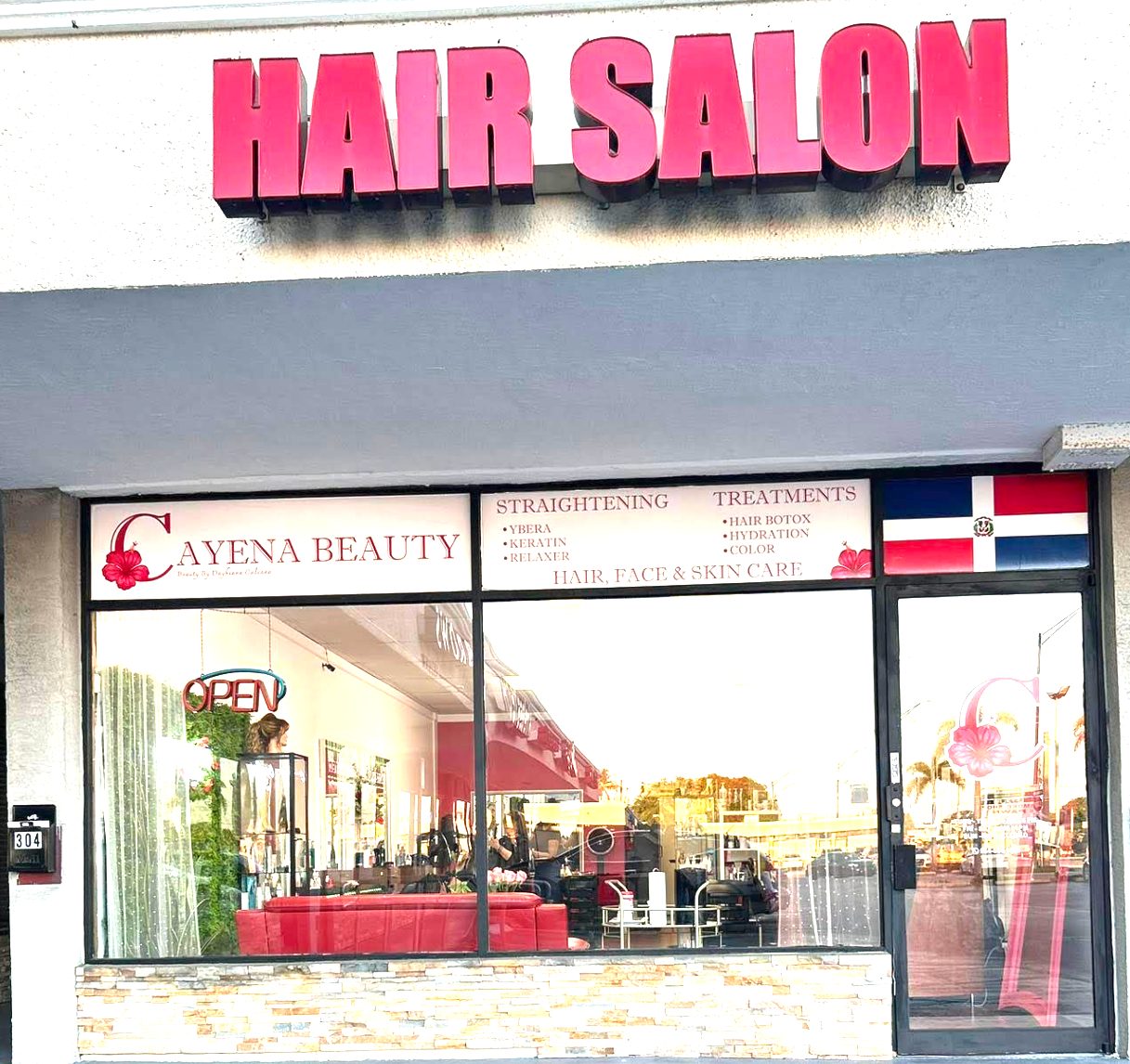 Cayena Beauty Salon storefront at 304 E Oakland Park Blvd, Oakland Park — red HAIR SALON sign visible from the street