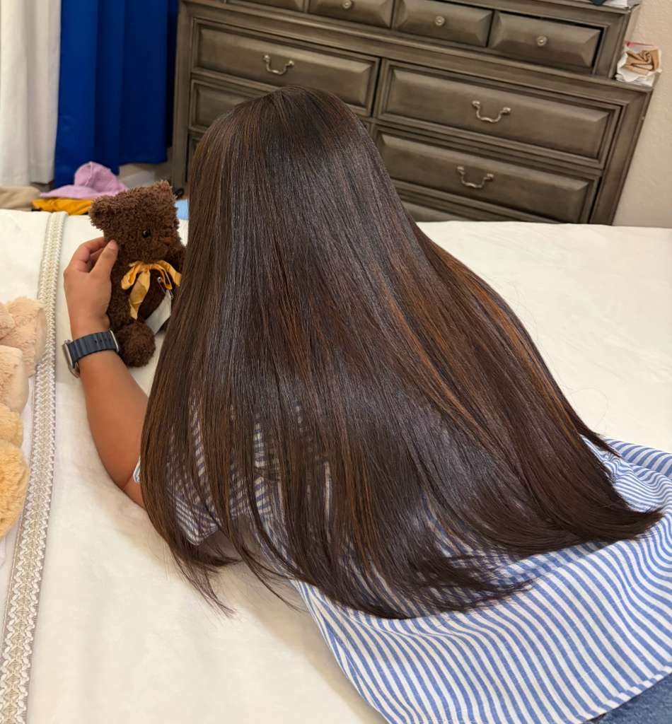 Treatment results — long shiny brown hair after a Cayena treatment